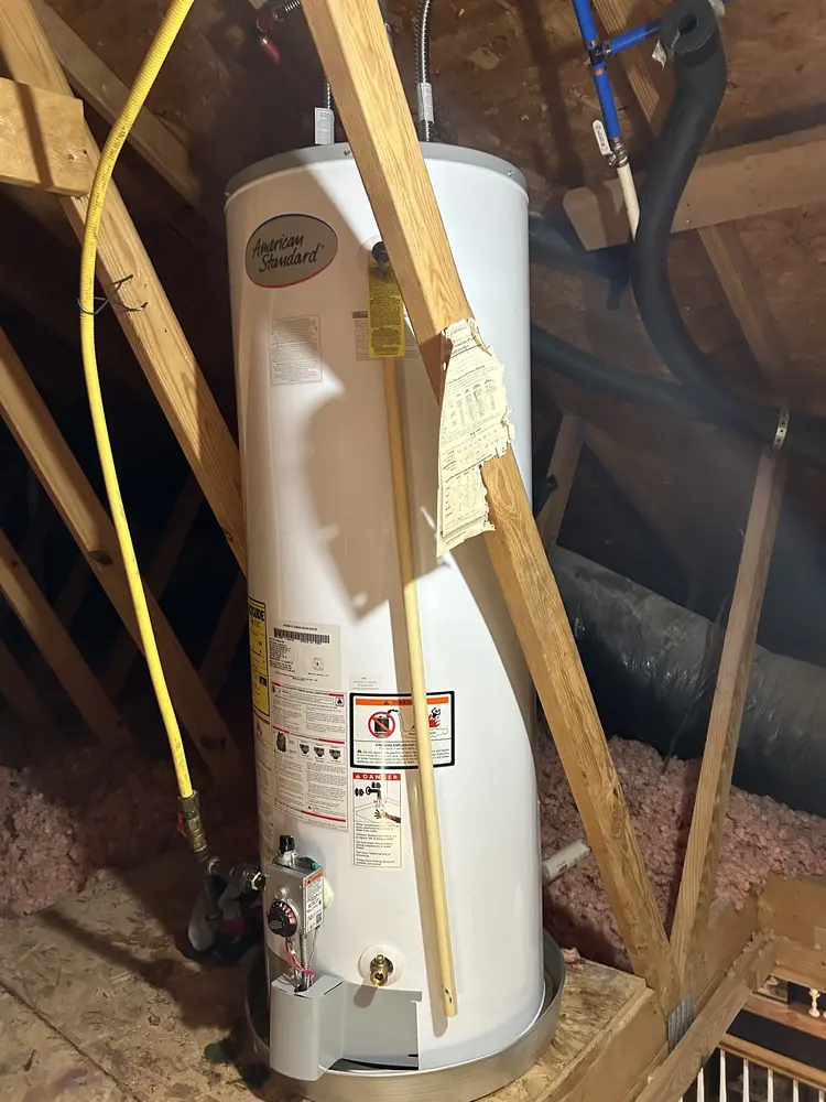 Gas water heater in an attic with a flexible gas supply line