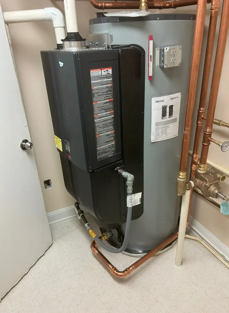 Rinnai tankless water heater paired with a storage tank, piped in copper